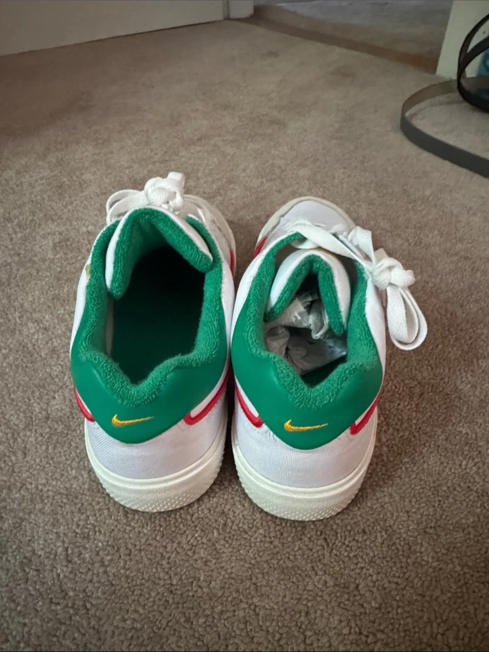 Nike White Sneakers with Green Swoosh and Red Stripe
